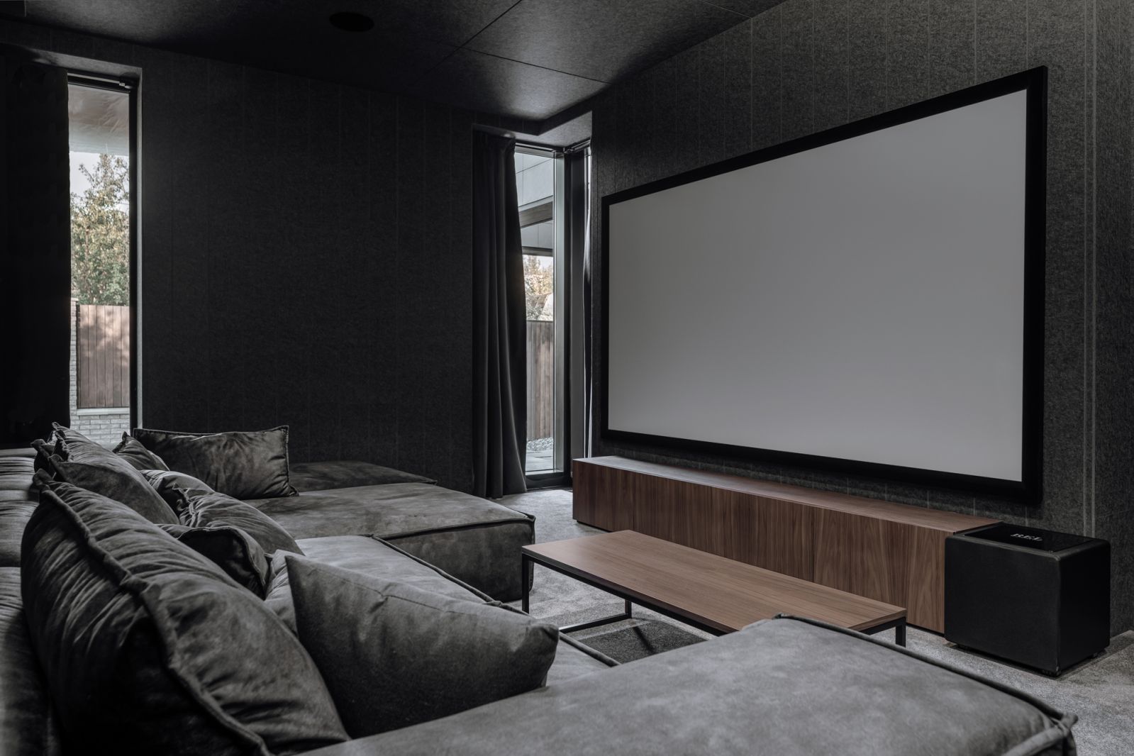 The home theatre features a commodious sofa set