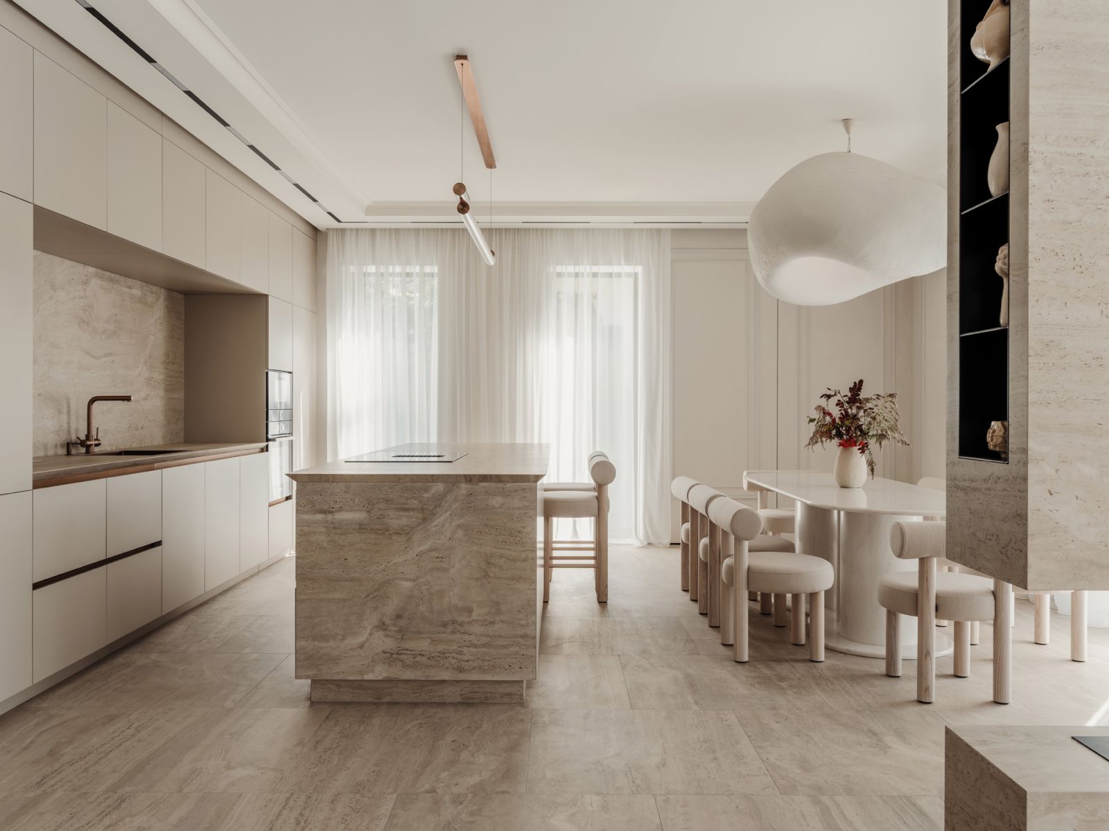 The kitchen and dining area in this Ukraine home features a light tone-on-tone material palette