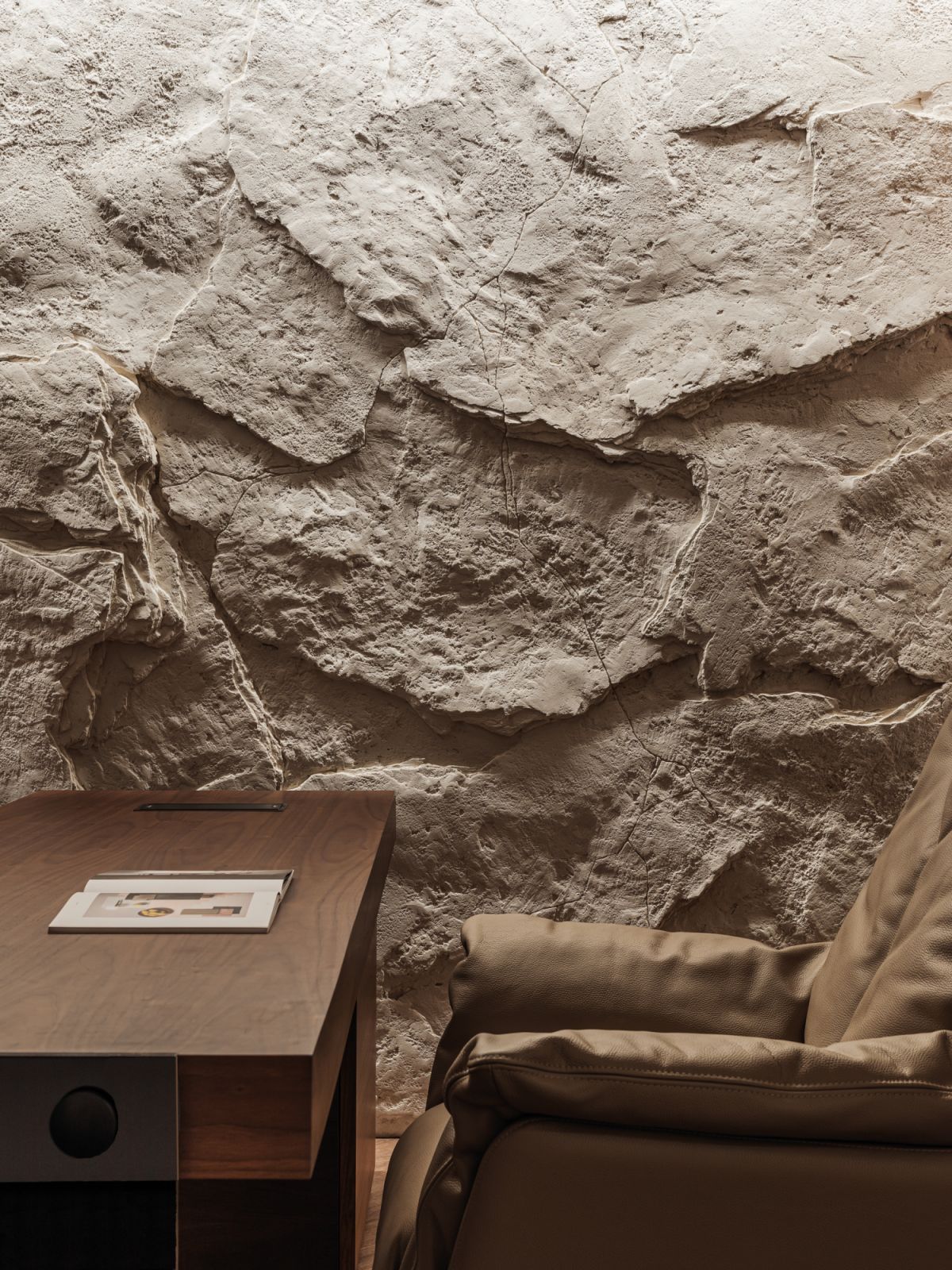 Rough-hewn stone brings an edge to the interior