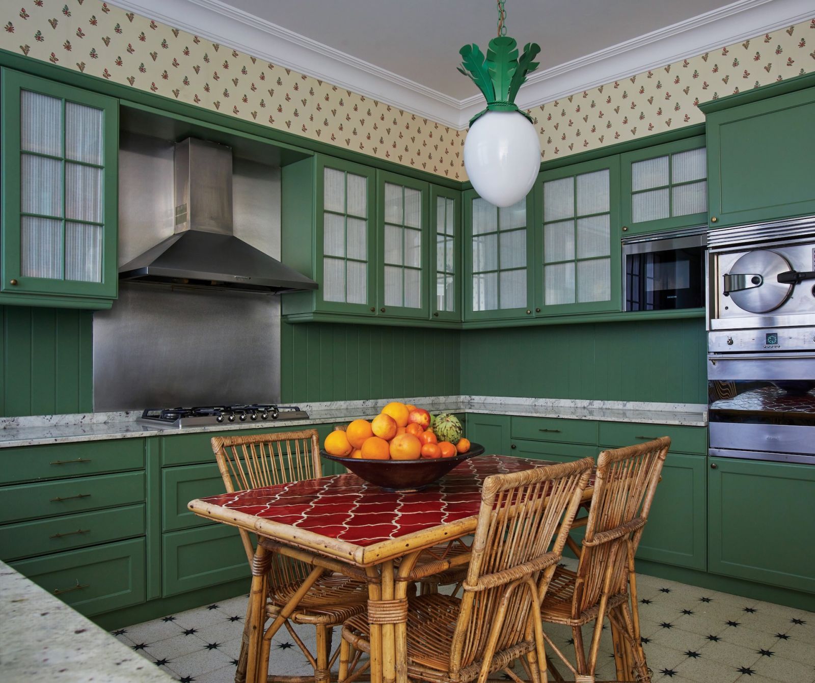Dodo Egg Lamp by Beata Heuma hangs in the dining room clad in Farrow and Ball Calke green