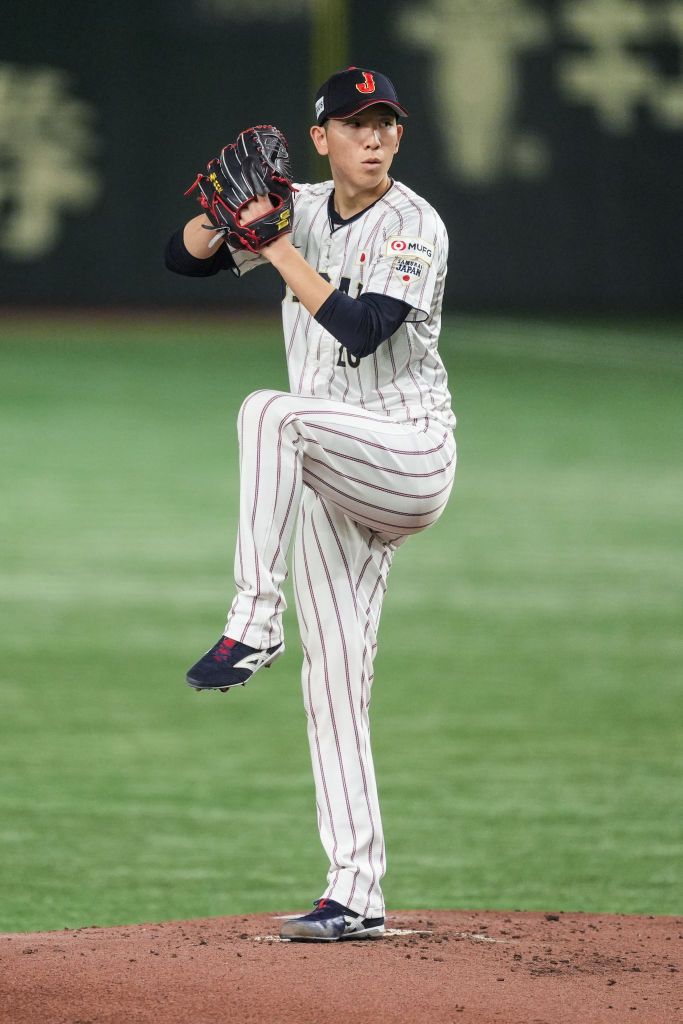 TOKYO, JAPAN - NOVEMBER 24: Shosei Togo #20 of Team Japan throws a pitch in the 2nd inning during the WBSC Premier12 Gold Medal game between Chinese Taipei and Japan at Tokyo Dome on November 24, 2024 in Tokyo, Japan. (Photo by Shi Tang/Getty Images)