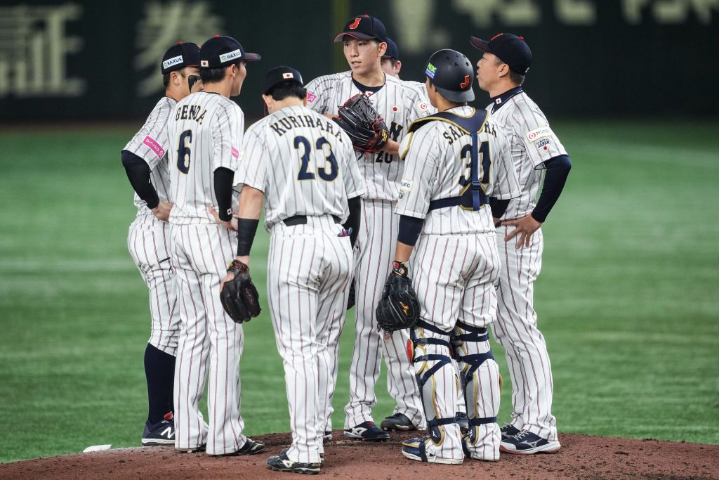 TOKYO, JAPAN - NOVEMBER 24: Members of Team Japan talk in the 5th inning during the WBSC Premier12 Gold Medal game between Chinese Taipei and Japan at Tokyo Dome on November 24, 2024 in Tokyo, Japan. (Photo by Shi Tang/Getty Images)