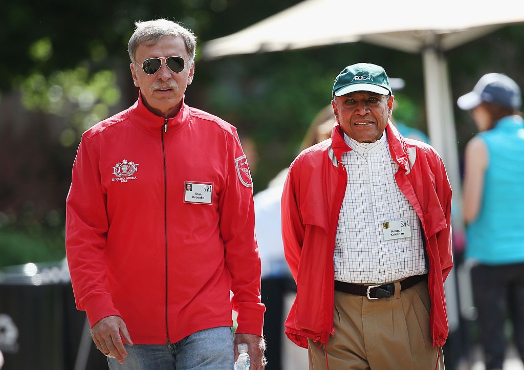 Stan Kroenke (L), owner of Kroenke Sports Enterprises, which includes the Denver Nuggets of the NBA, Colorado Avalanche of the NHL, Colorado Rapids of Major League Soccer, Colorado Mammoth of the National Lacrosse League and St. Louis Rams of the NFL, chats with Ananda Krishnan, Malaysian businessman and philanthropist, at the Allen & Company Sun Valley Conference on July 8, 2015 in Sun Valley, Idaho