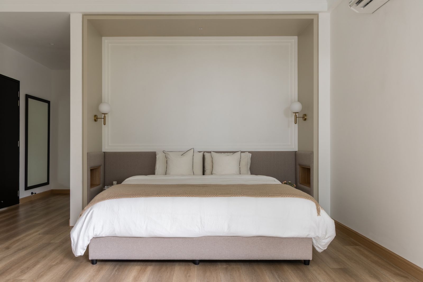 The serene master bedroom showcases the home’s commitment to creating tranquil spaces