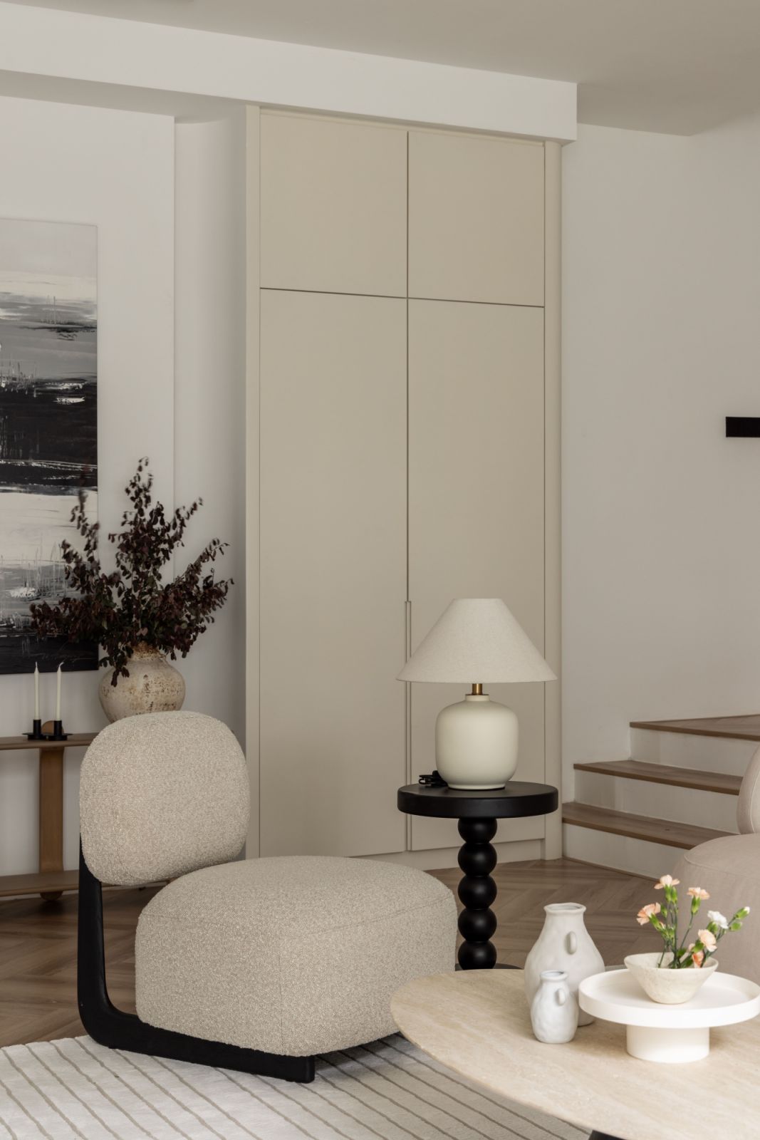 The rounded forms, rendered in warm neutral tones, add a sense of comfort and fluidity to the minimalist space