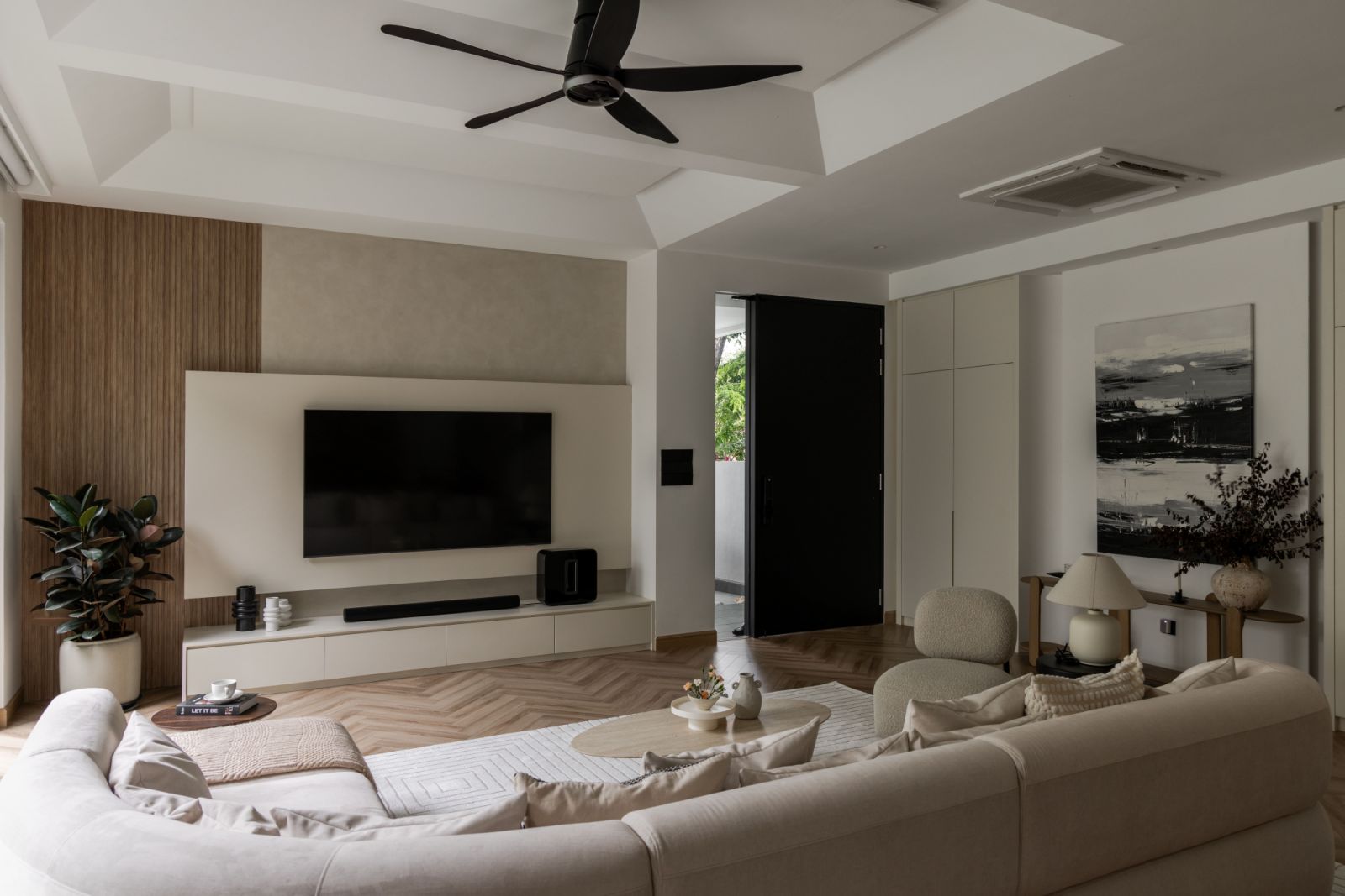 The light-filled living area perfectly balances form and function, where custom-built furniture meets thoughtful spatial planning