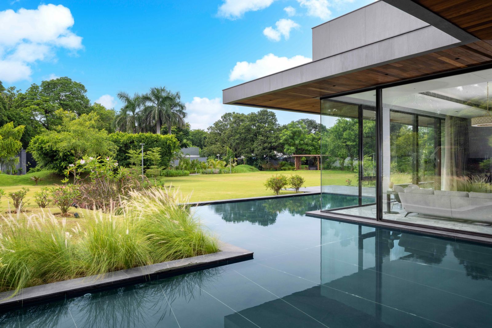 Body of water encircles the main structure, evoking a zen-like openness to nature