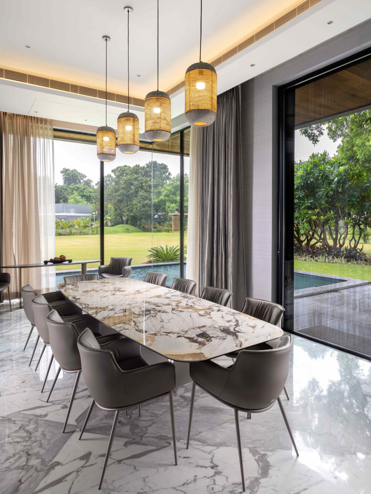 The formal dining room integrates with the outdoor nature