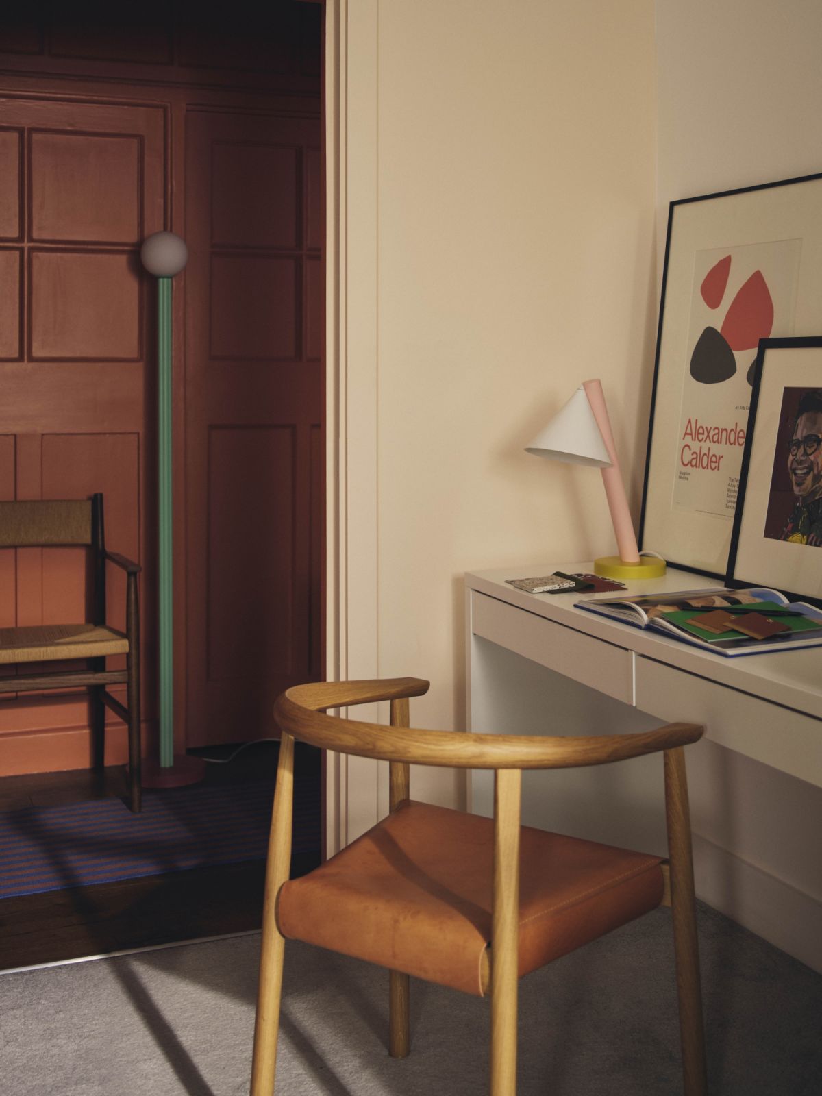In one of the rooms, the desk is decorated with an Alexander Calder print edition from Tate, a personally commissioned portrait by Jessica Rose Bird, the Tokyo chair by Bensen, Arv armchair from Brdr Krüger and Atelier Areti lamps (Photo: Nick Rochowski)
