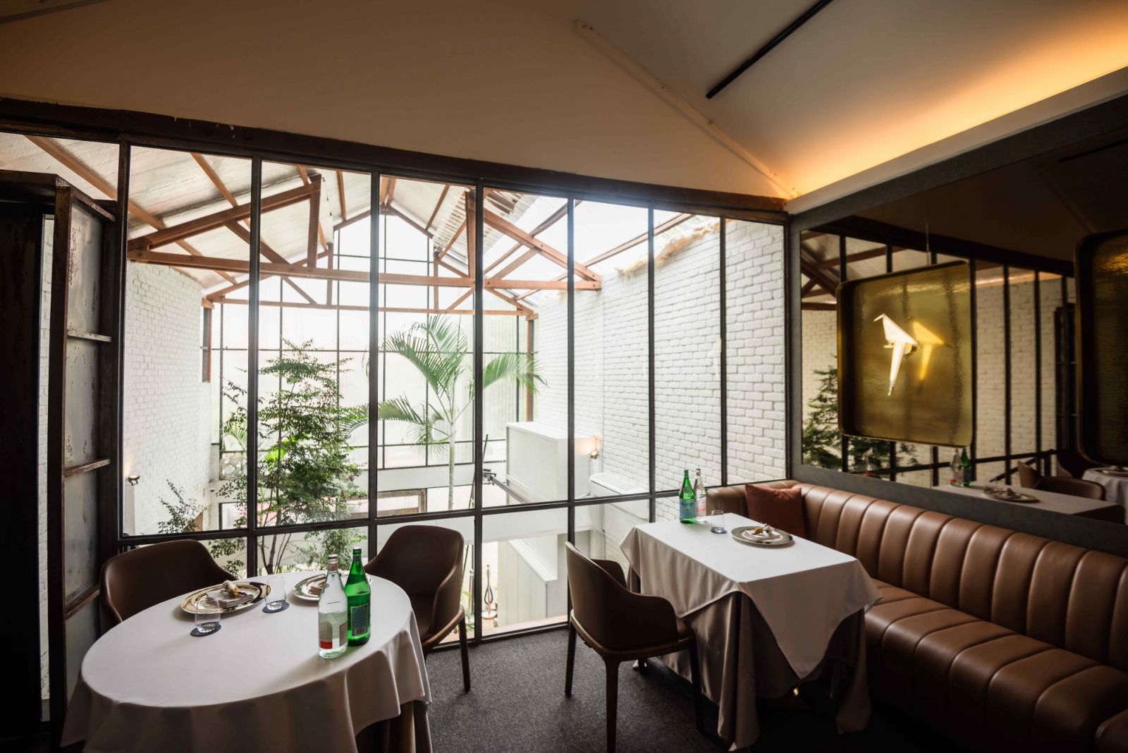 The seating area on the upper floor overlooks the bright, open foyer