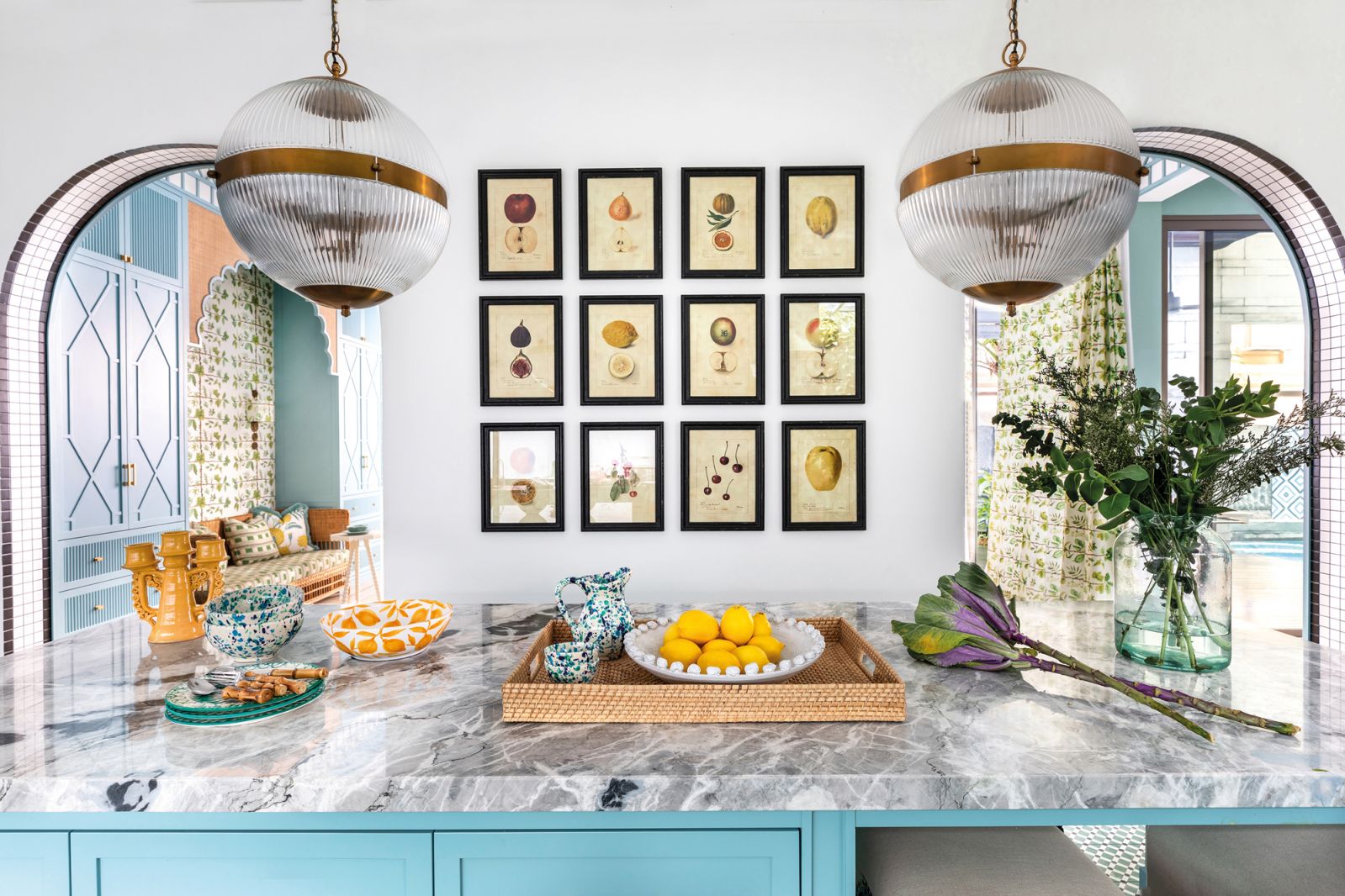 A new marble-topped island and blue-painted cabinetry breathe vitality into the kitchen