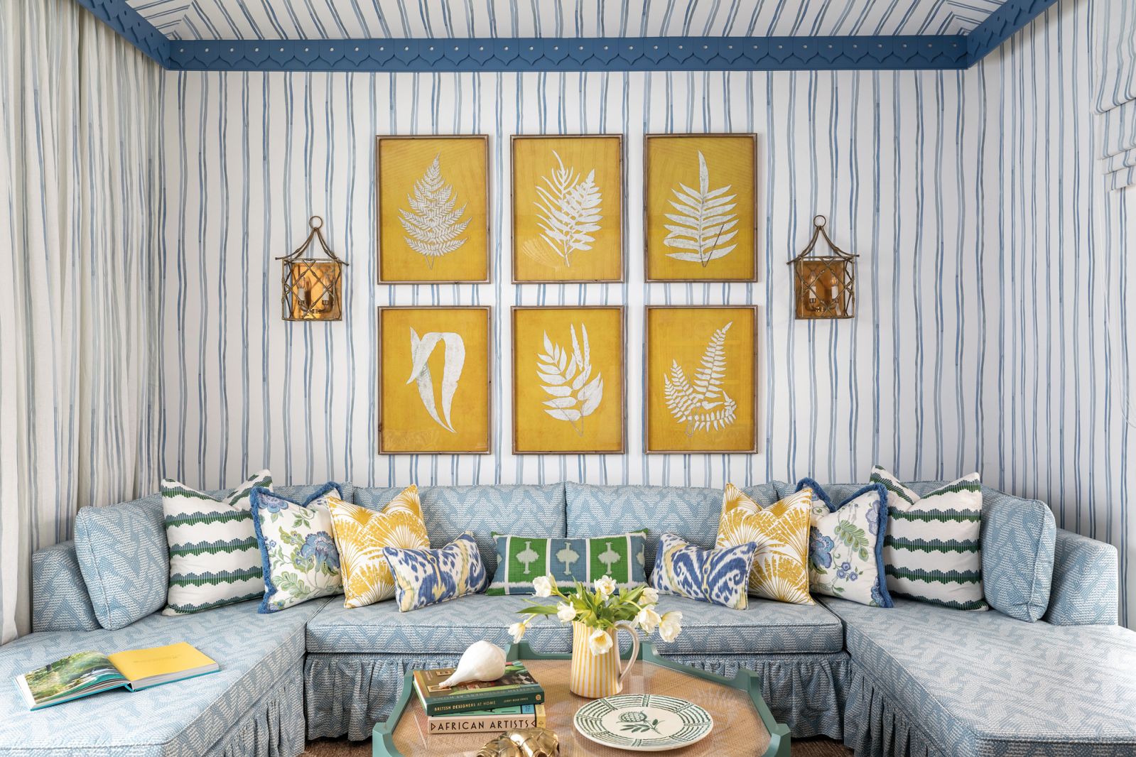 The tented ceiling brings a playful air to the TV room