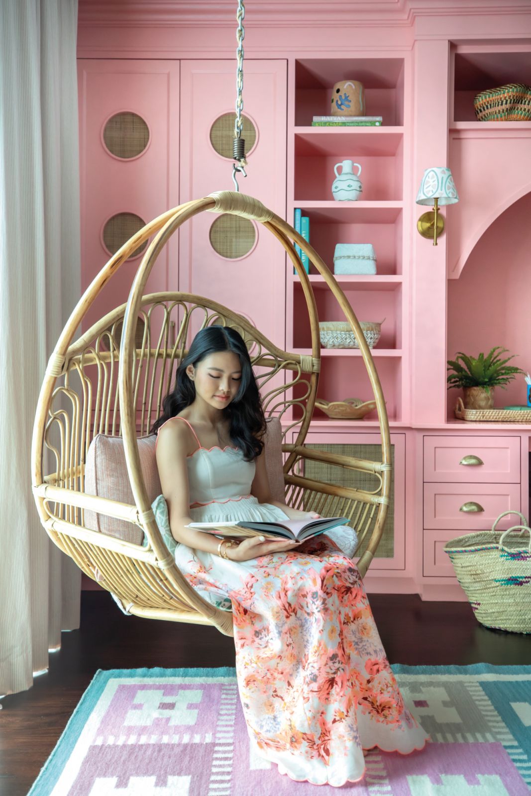 A rattan swing chair brings a leisurely touch to the elder daughter’s bedroom