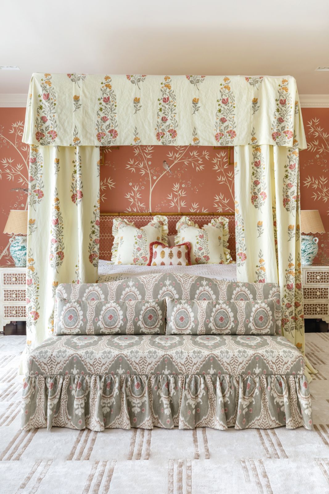 This bespoke four-poster bed holds court in the master suite with its tropical-chic character