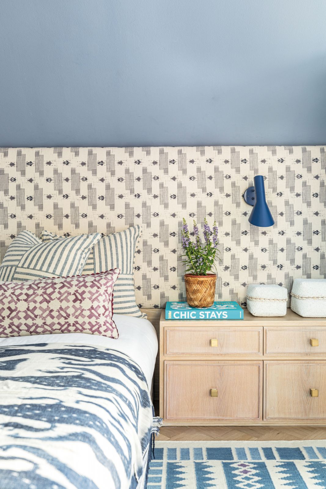 The younger son’s bedroom sports a nautical vibe and a palette of blues and purples