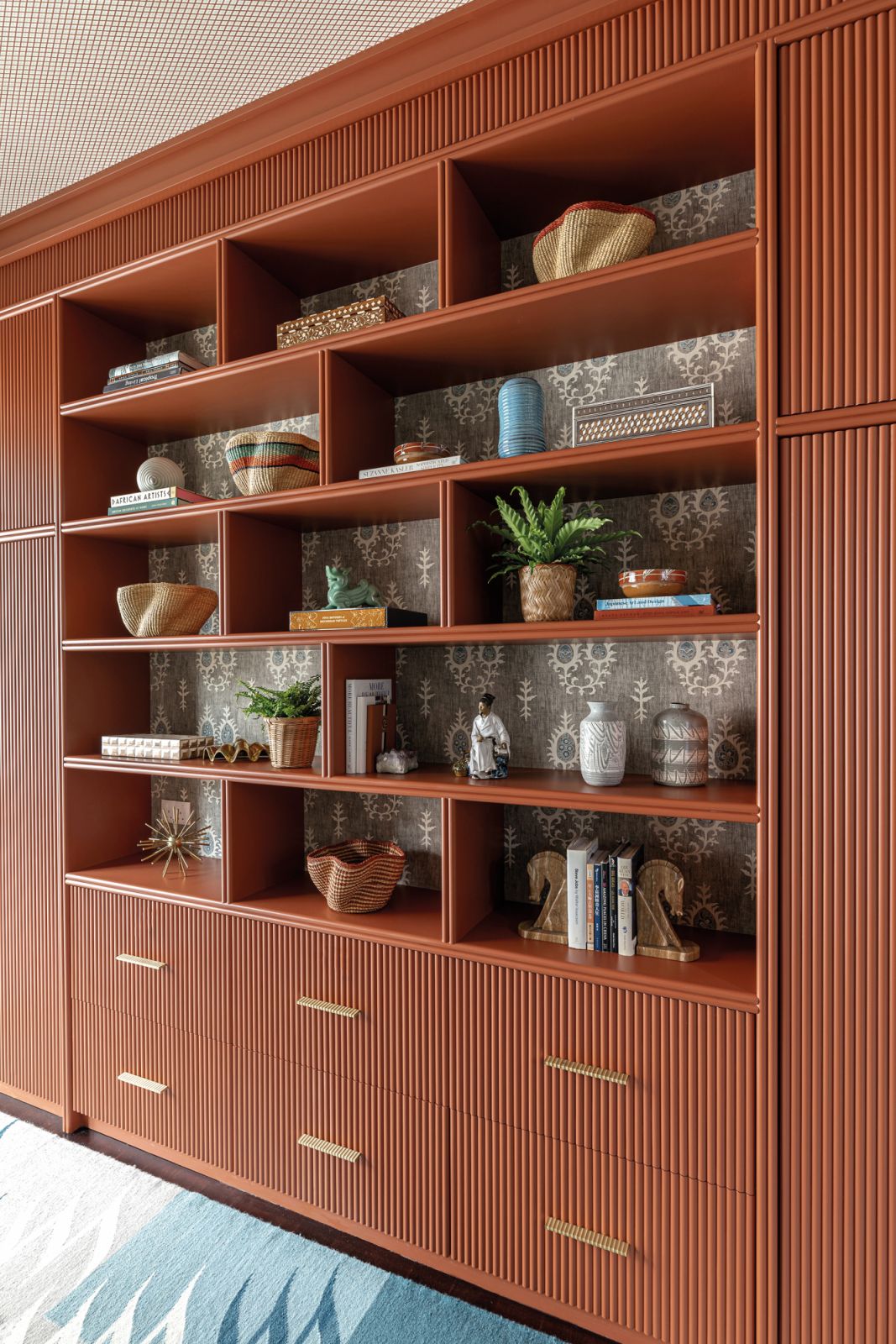 The botanical motif here is balanced by masculine rust tones