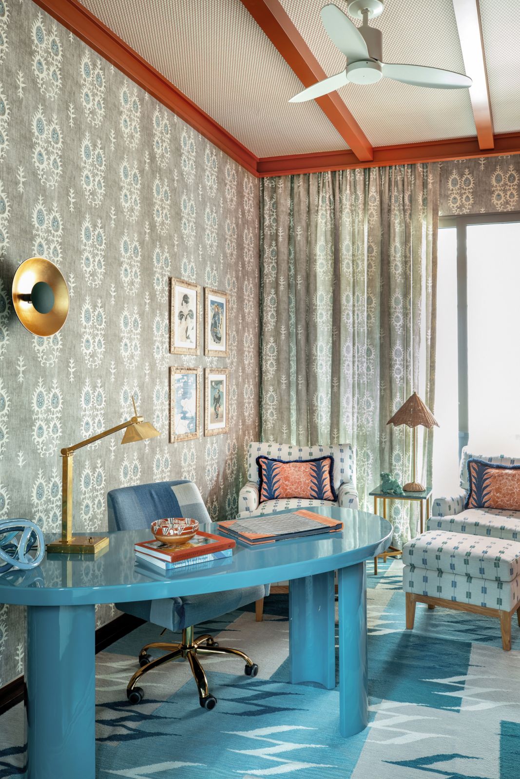 The husband’s study features a vintage-inspired floral print on the wallpaper and curtains
