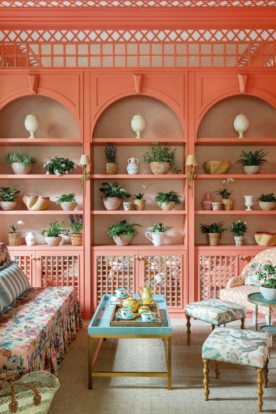 The tea room is an enchanting space awash in coral and sage hues