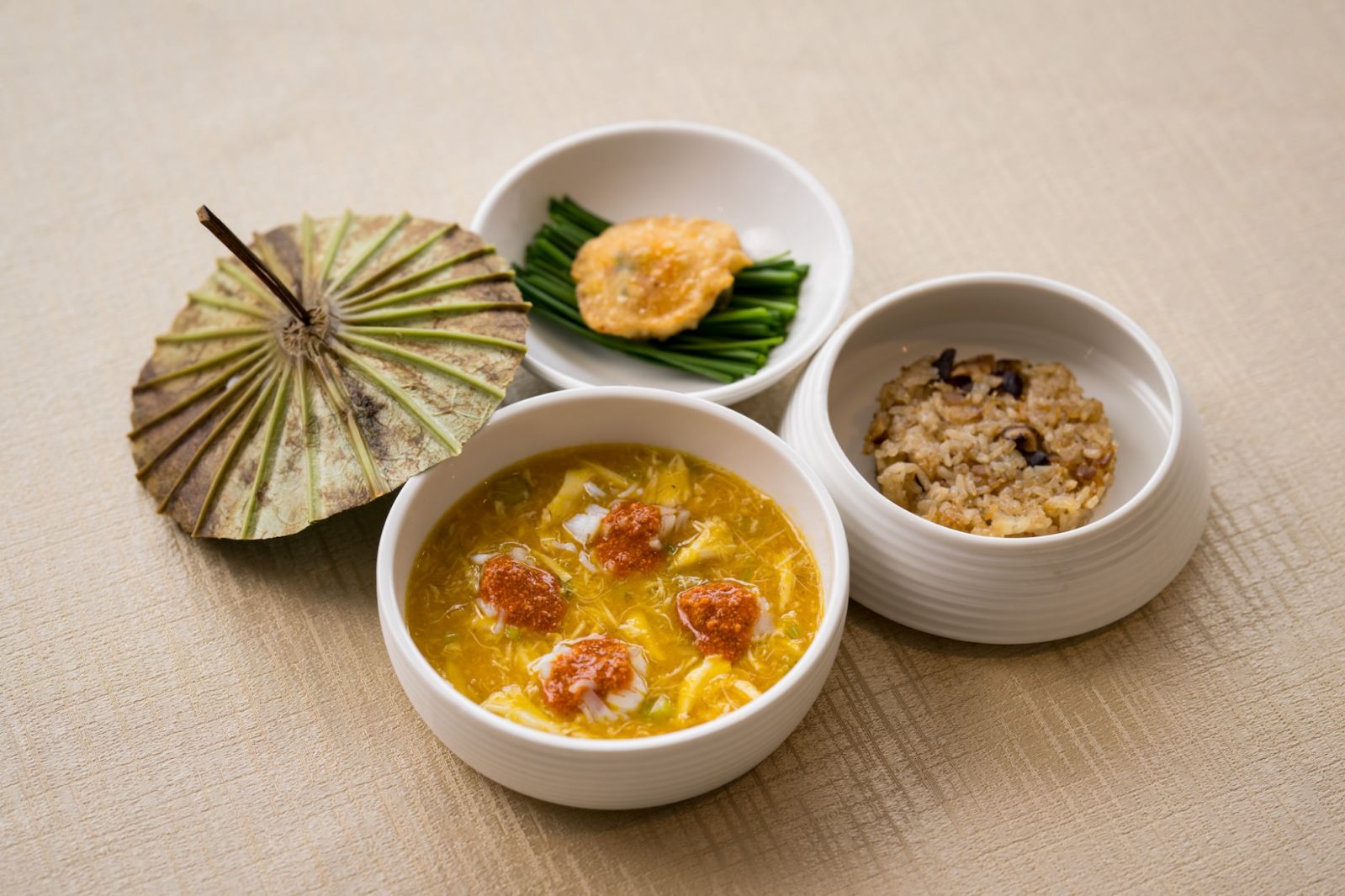 Modern expressions of crab claw, crab roe, and crispy lard coin fritter at Peach Blossoms (Photo: SQ Photography) best Chinese restaurant singapore