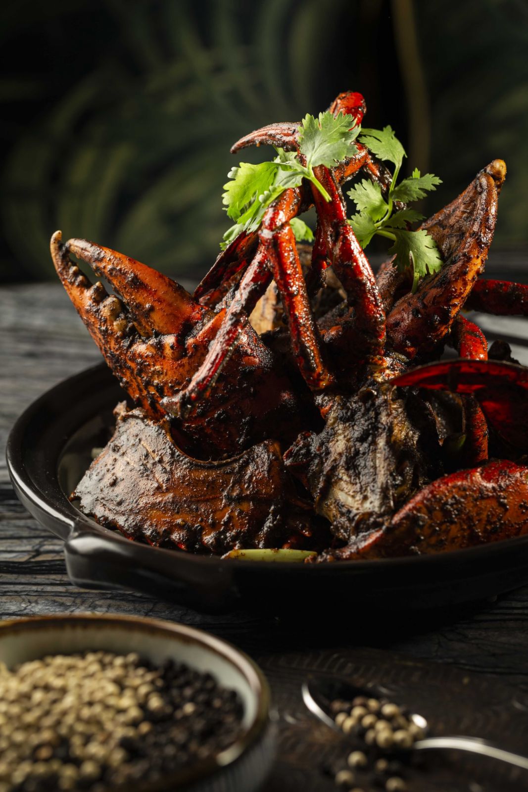 Wok-fried live whole crab in Singapore black pepper style sauce (Photo: Mott 32 Singapore) best Chinese restaurant singapore