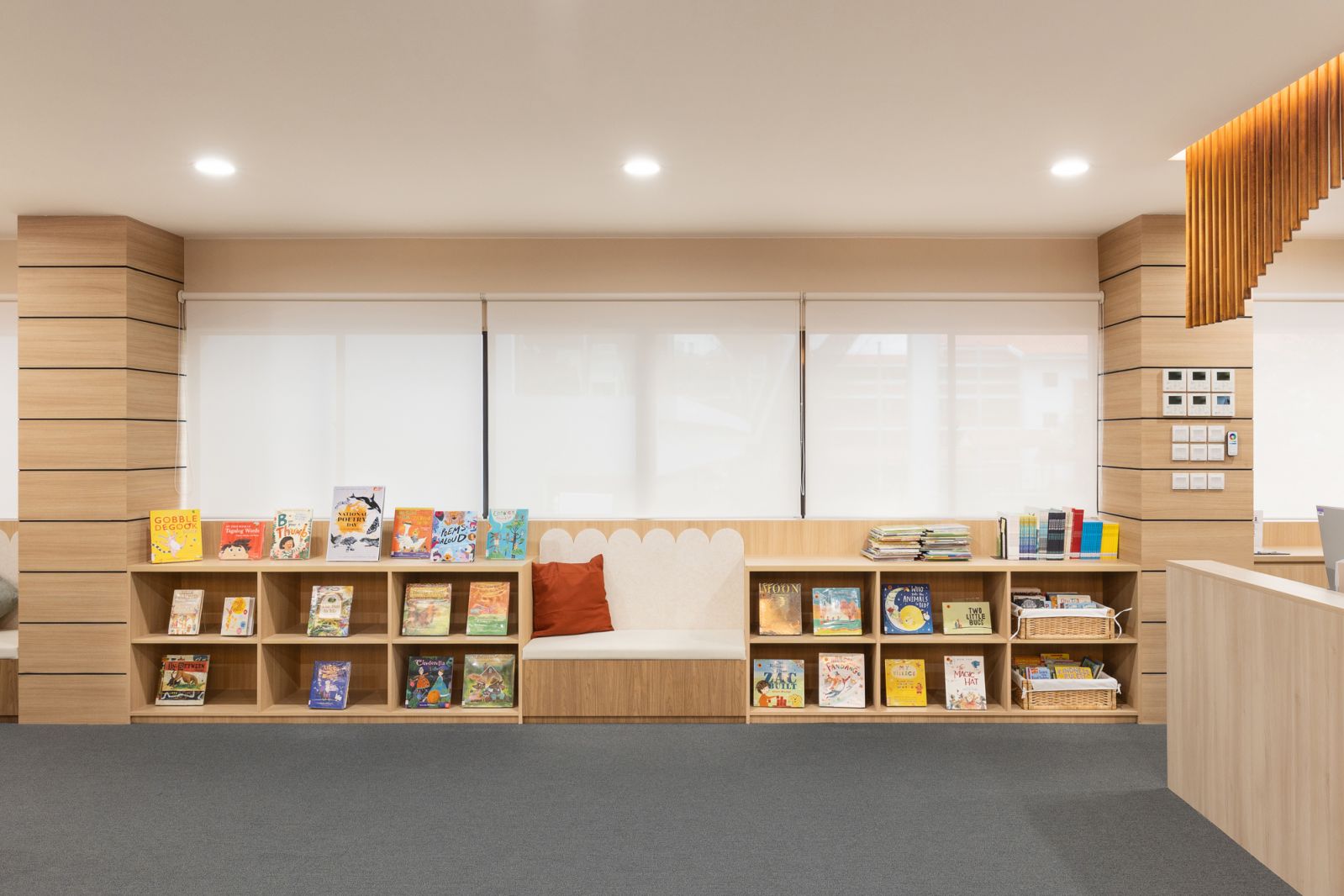 This thoughtfully curated space includes built-in bookcases and a cosy sitting nook, creating an inviting atmosphere