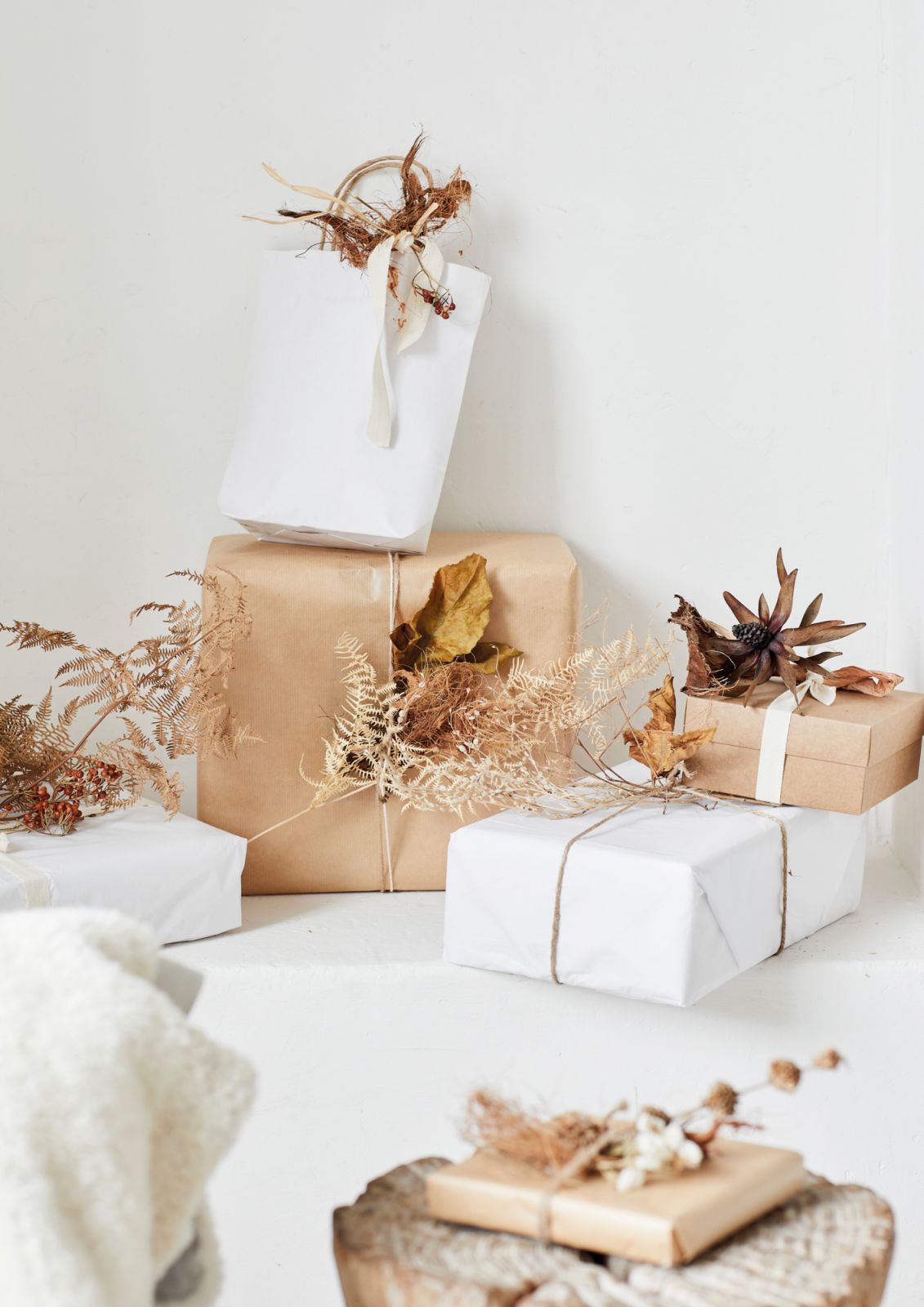 The two-tone gift-wrapping look can be achieved with sheets of white tissue paper, newsprint or brown craft paper