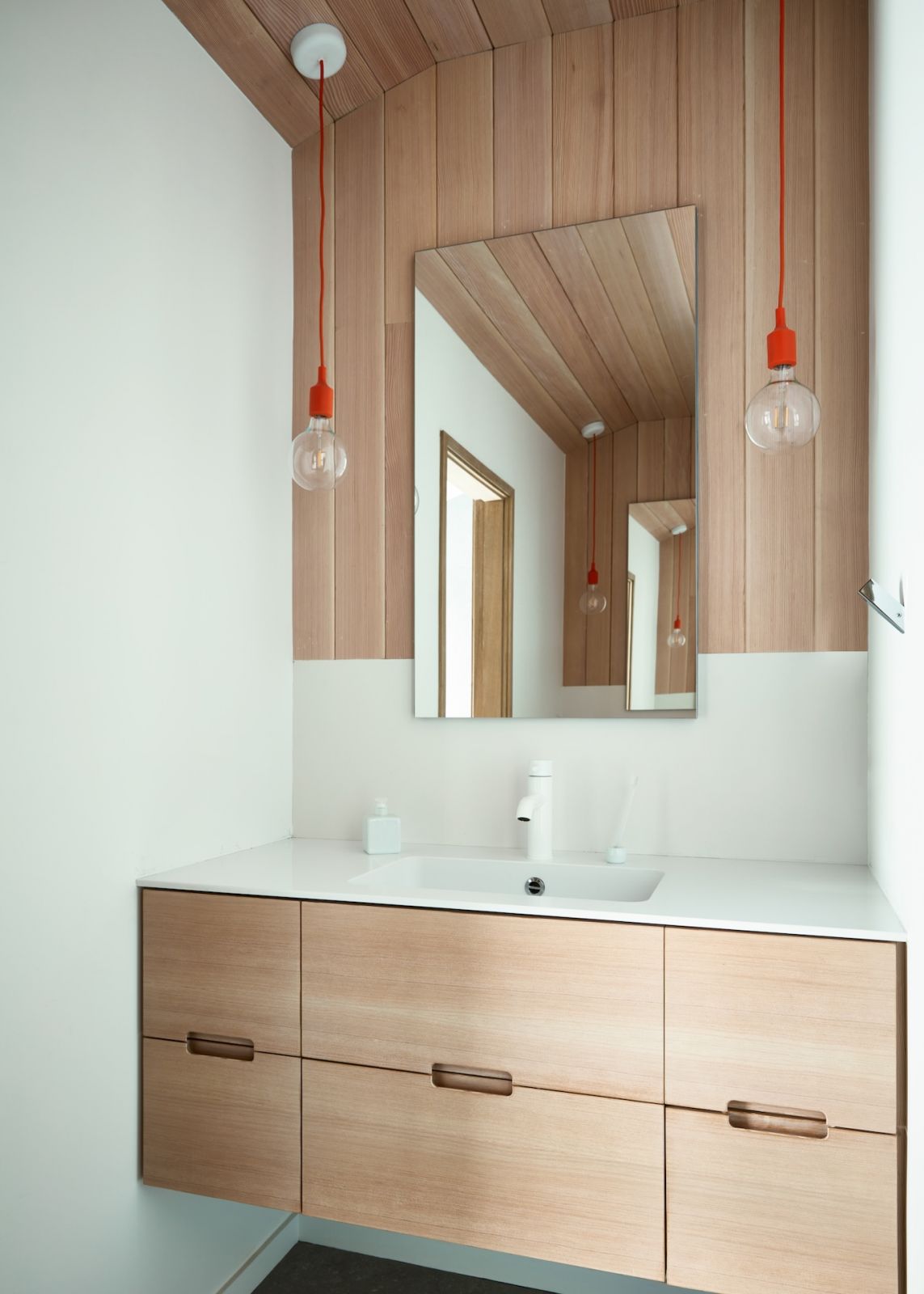 One of the home's bathrooms, highlighting the usage of soothing wood