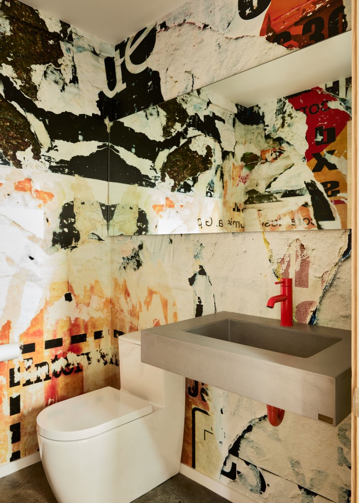 One of the bathrooms in the home, with unique graphic wallpaper