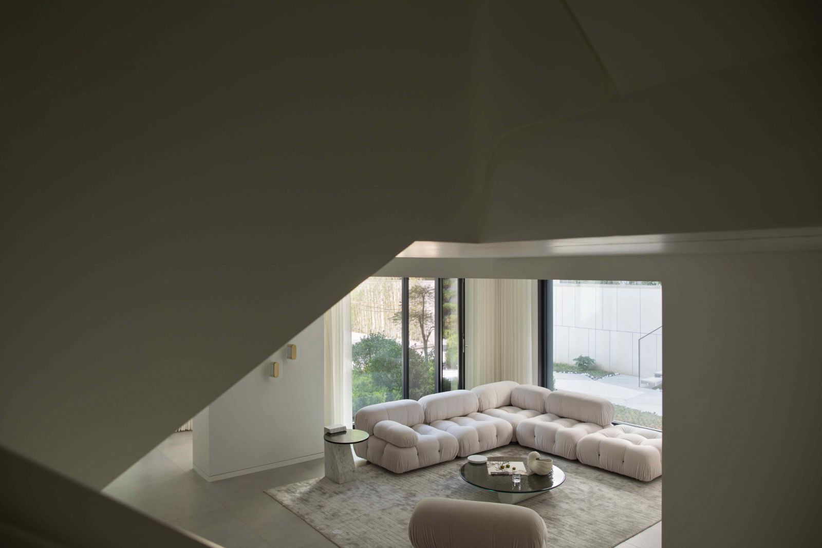 The living room on the basement level is connected to the garden