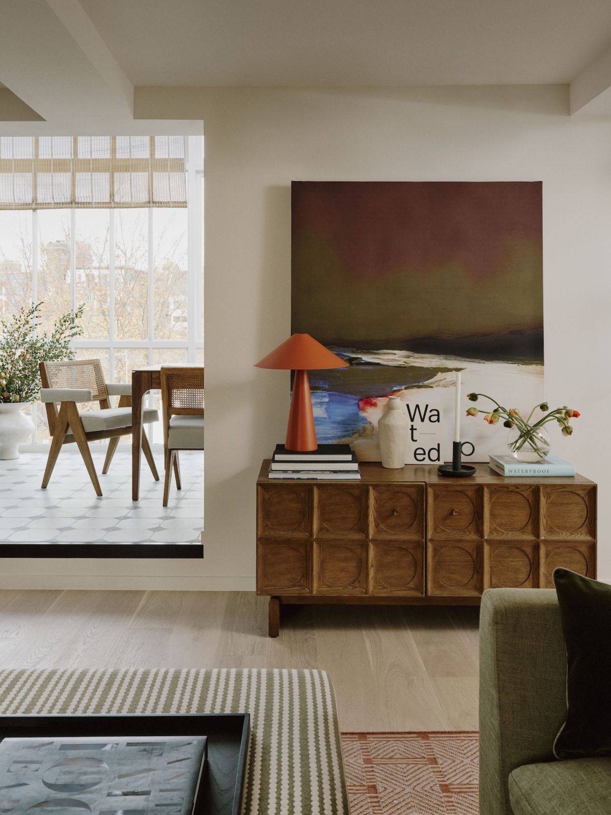 Light-filled hallway connecting spaces in a home