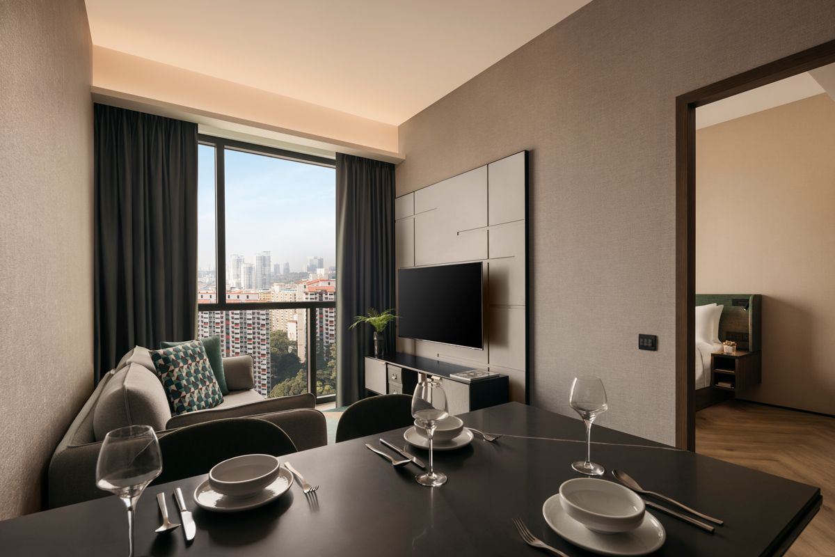 The cosy, seamless dining and living spaces at Quincy House's One-Bedroom Deluxe apartment