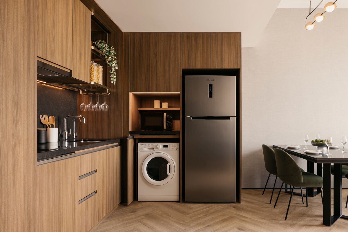The compact, cleverly designed kitchen includes a washer/dryer unit