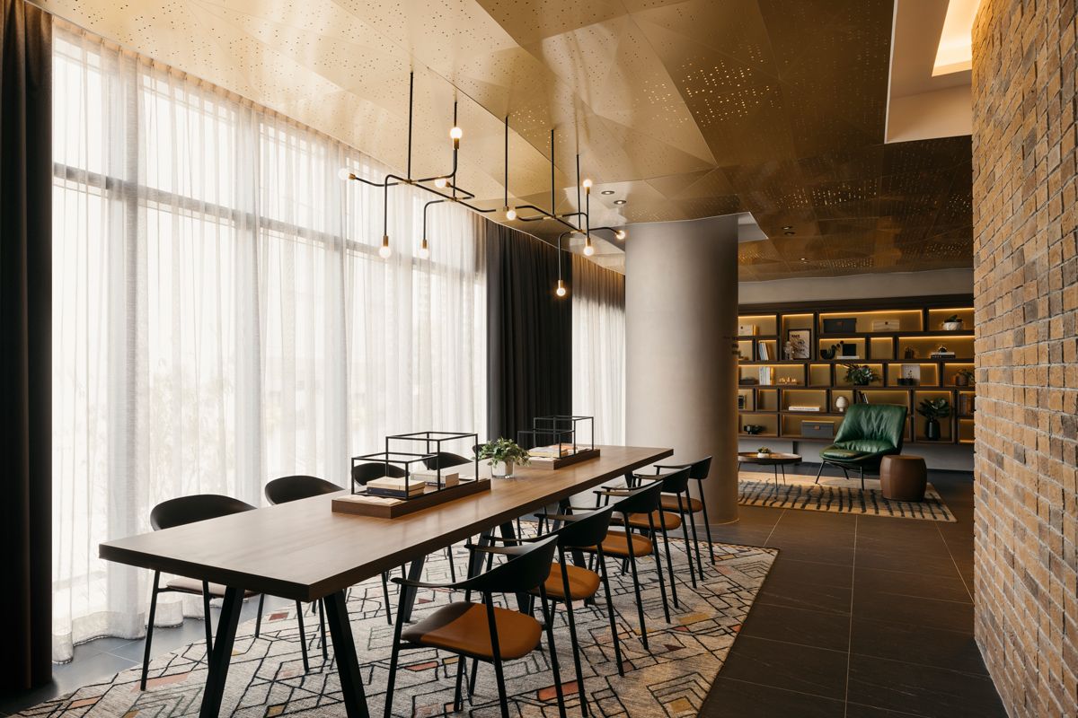 This long table at the common lounge serves as dining area as well as a communal working area