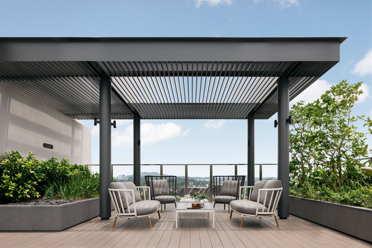 The outdoor lounge area next to the pool offers a respite from the busy urban life