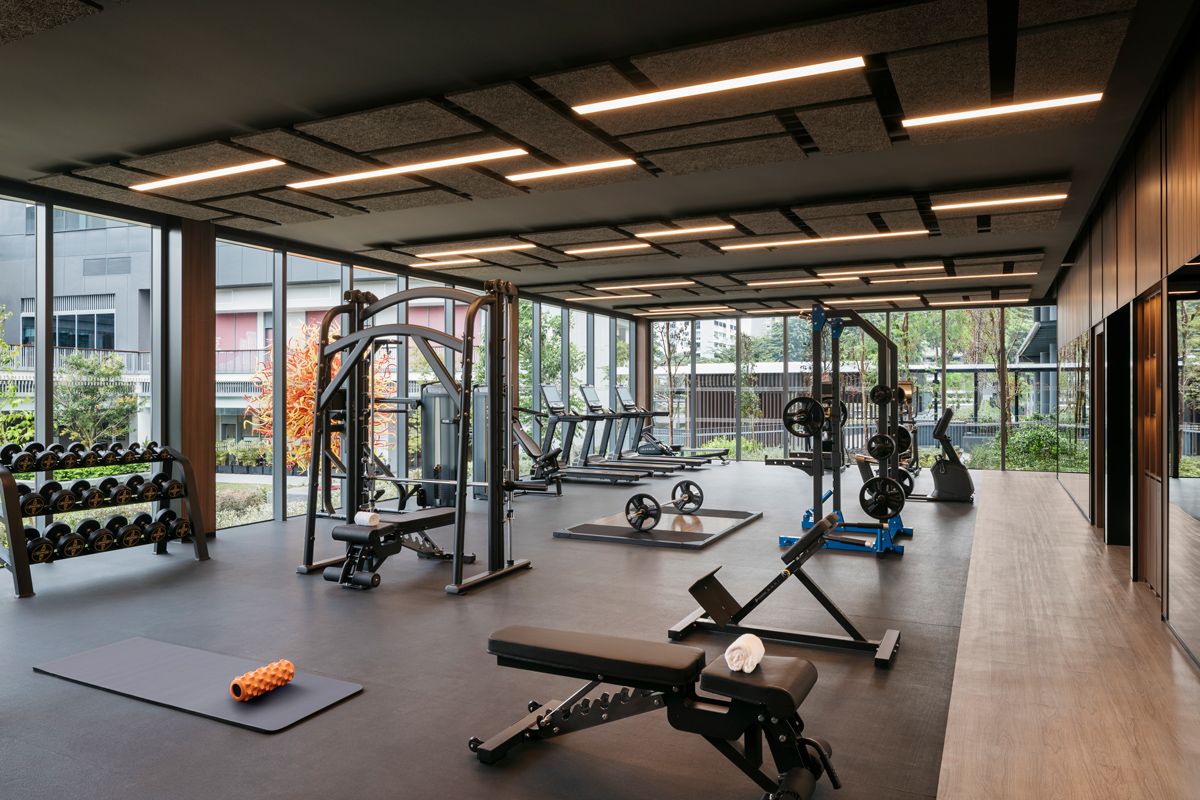 The well-equipped gym area has a view of Dale Chihuly's sculpture