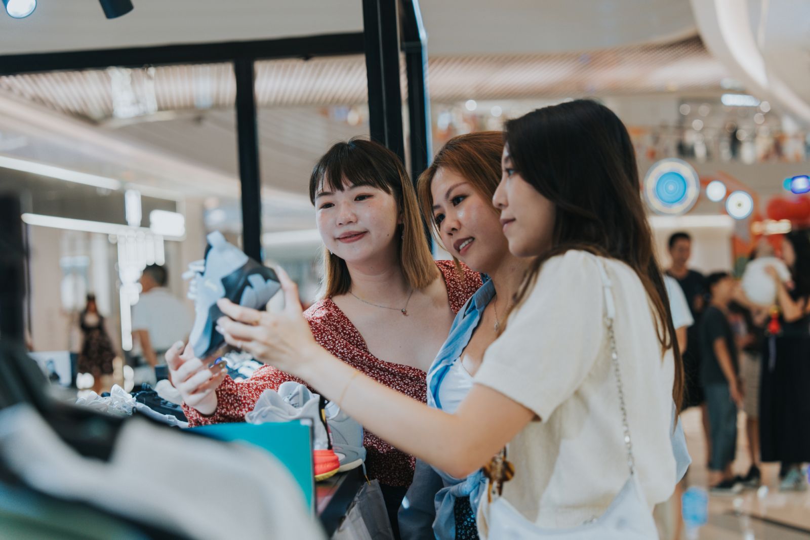 Happy Generation Z girls tavelling in Zhuhai, Greater Bay Area, China, walking around near the hotel and exploring the shopping mall