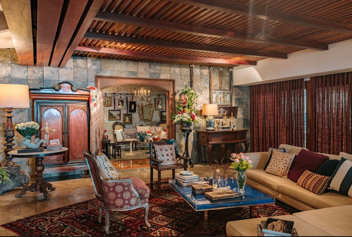Jaime Ponce de Leon home tour: The living room with salted hardwood for the ceiling and natural stone for the walls