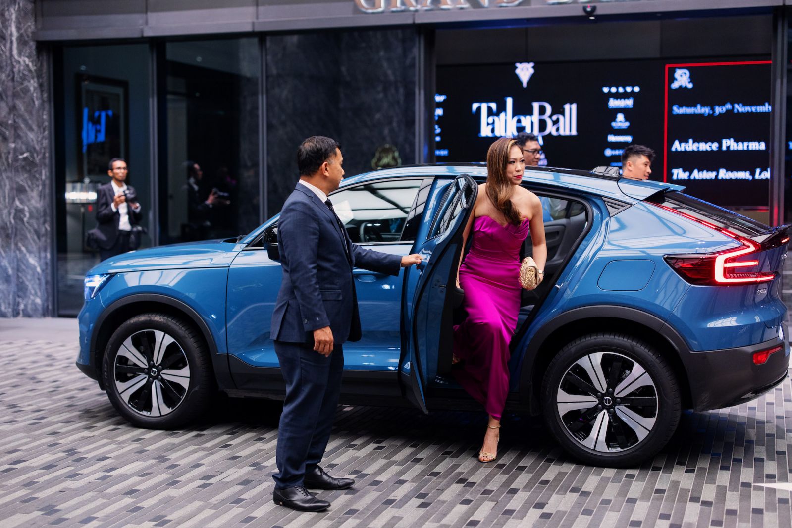 Diane Chia and Nicholas Caoile alighting from their Volvo pick-up