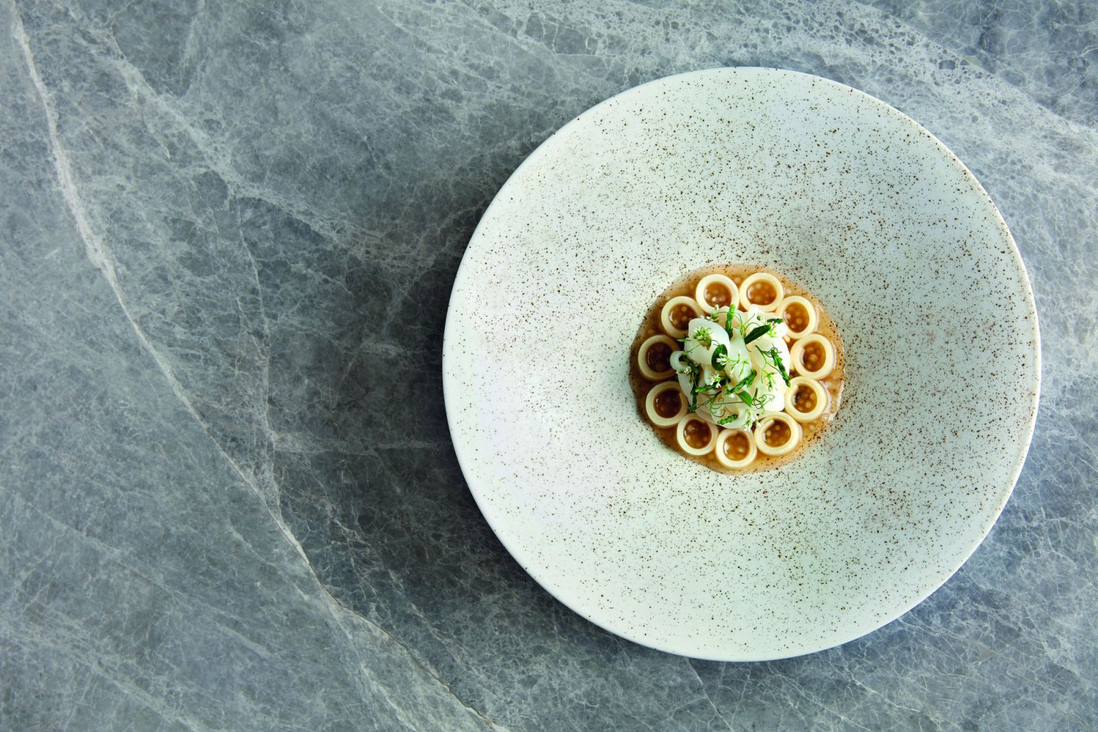 Akuna's squid dumplings with seaweed, palm heart, squid dumplings and grilled squid pearls
