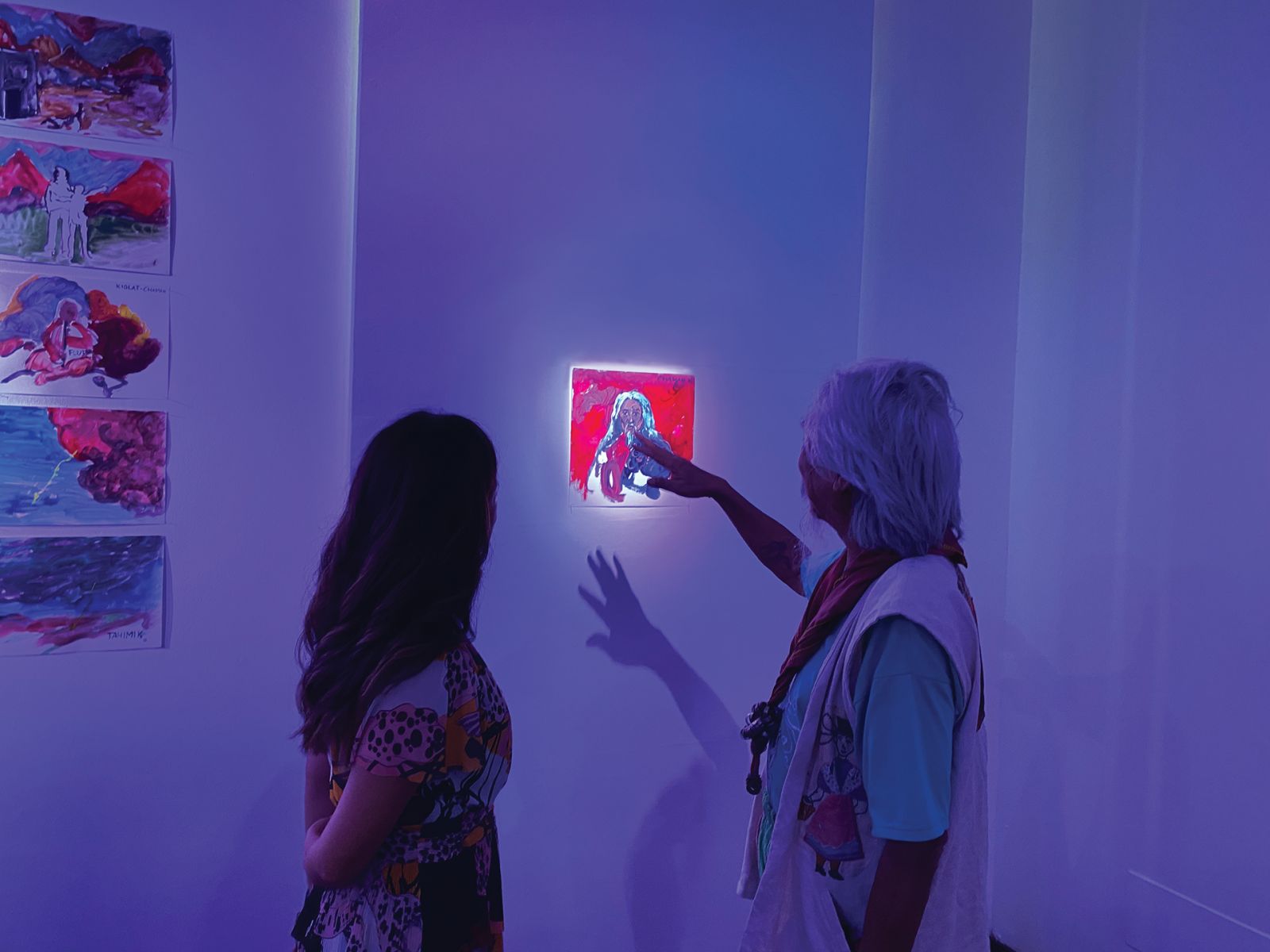 National Artist Kidlat Tahimik looking at his watercolour portrait by Enrique Marty at Instituto Cervantes (Photo: Courtesy of Kristine Guzmán)