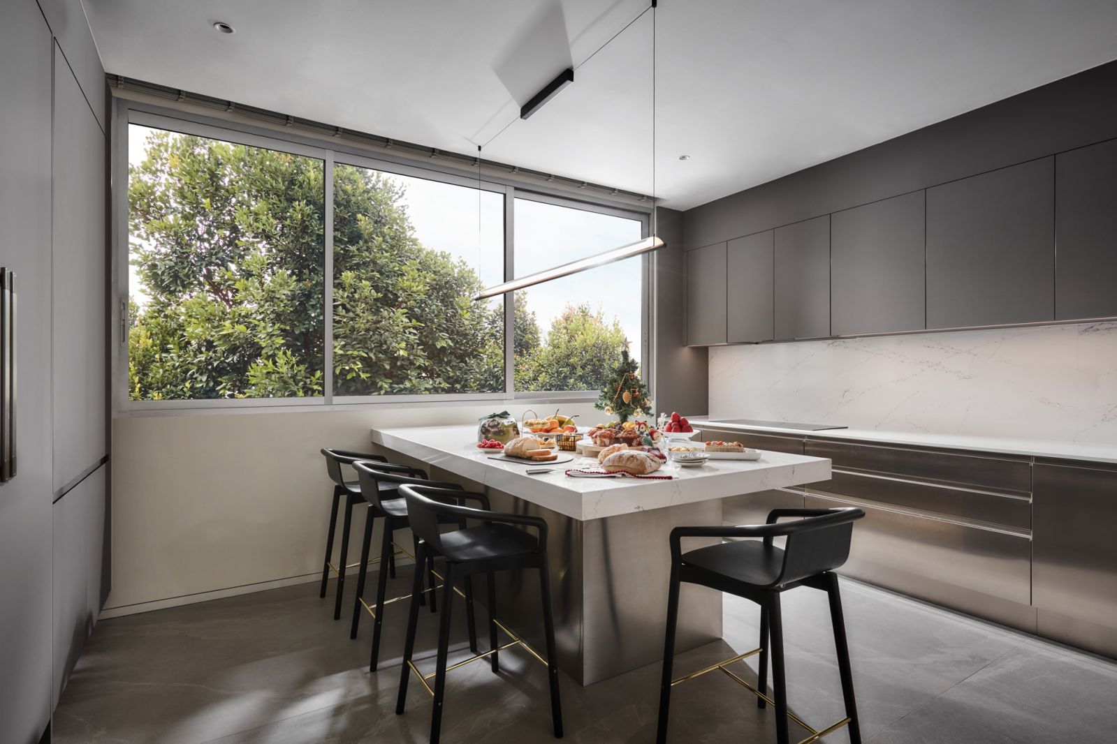 The kitchen was designed to circumvent the constraints of the original condominium’s layout for six family members