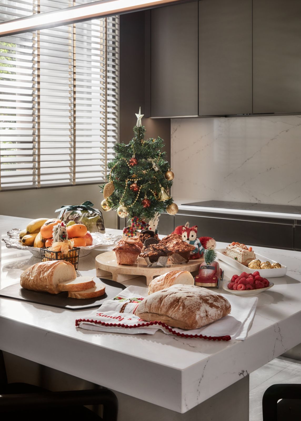 The kitchen design facilitates effortless preparation and cleanup for special occasions like the Christmas Eve dinner