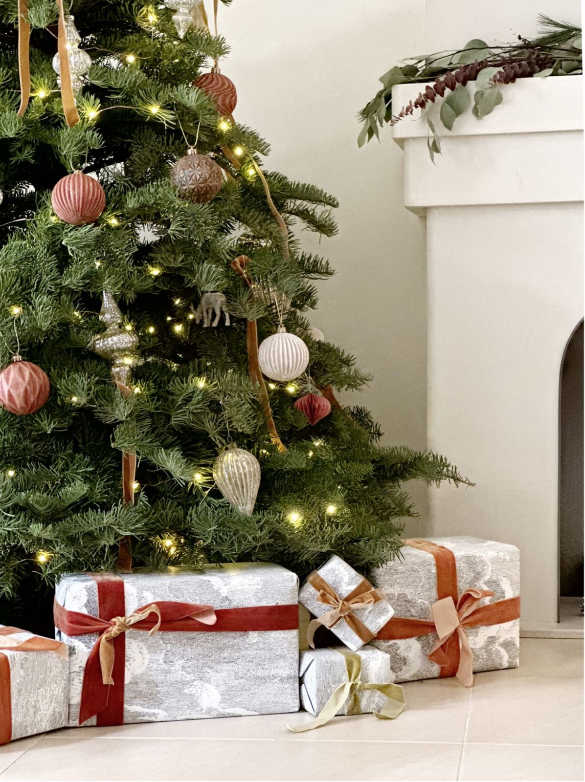 Christmas gifts wrapped in reused paper from a previous renovation project by Liquid Interiors