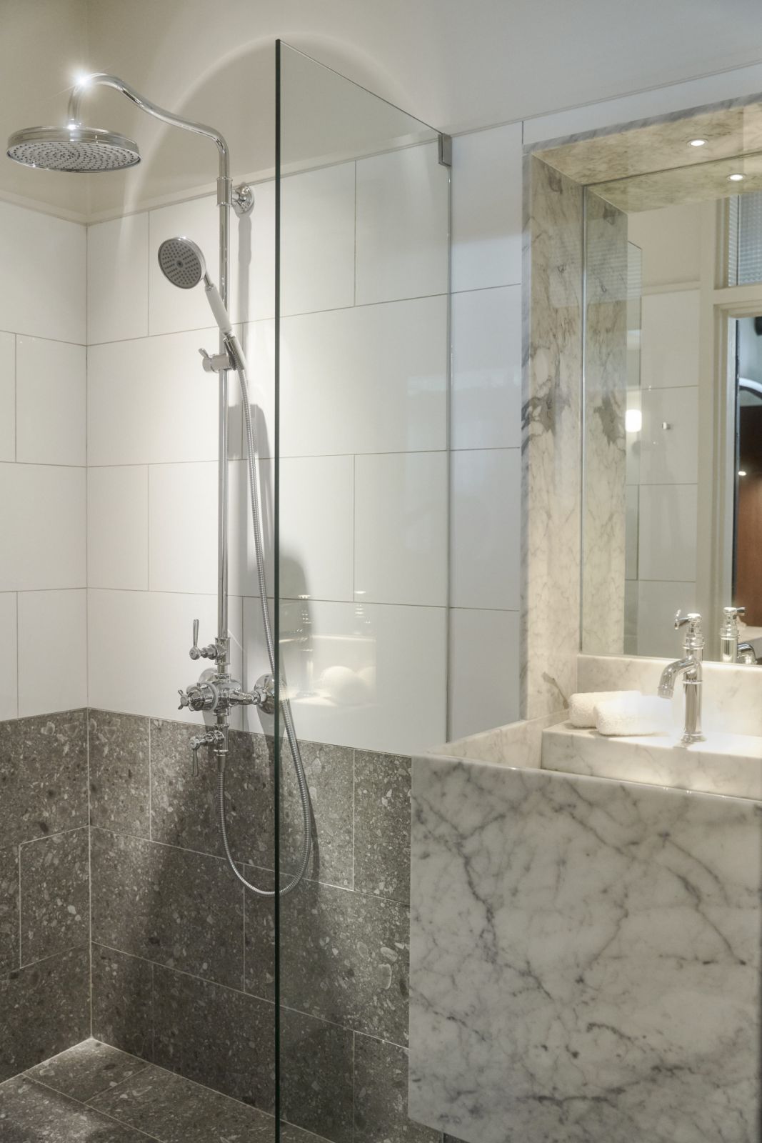 The renovated bathrooms blend luxury with practicality, featuring premium fittings and rainfall showers