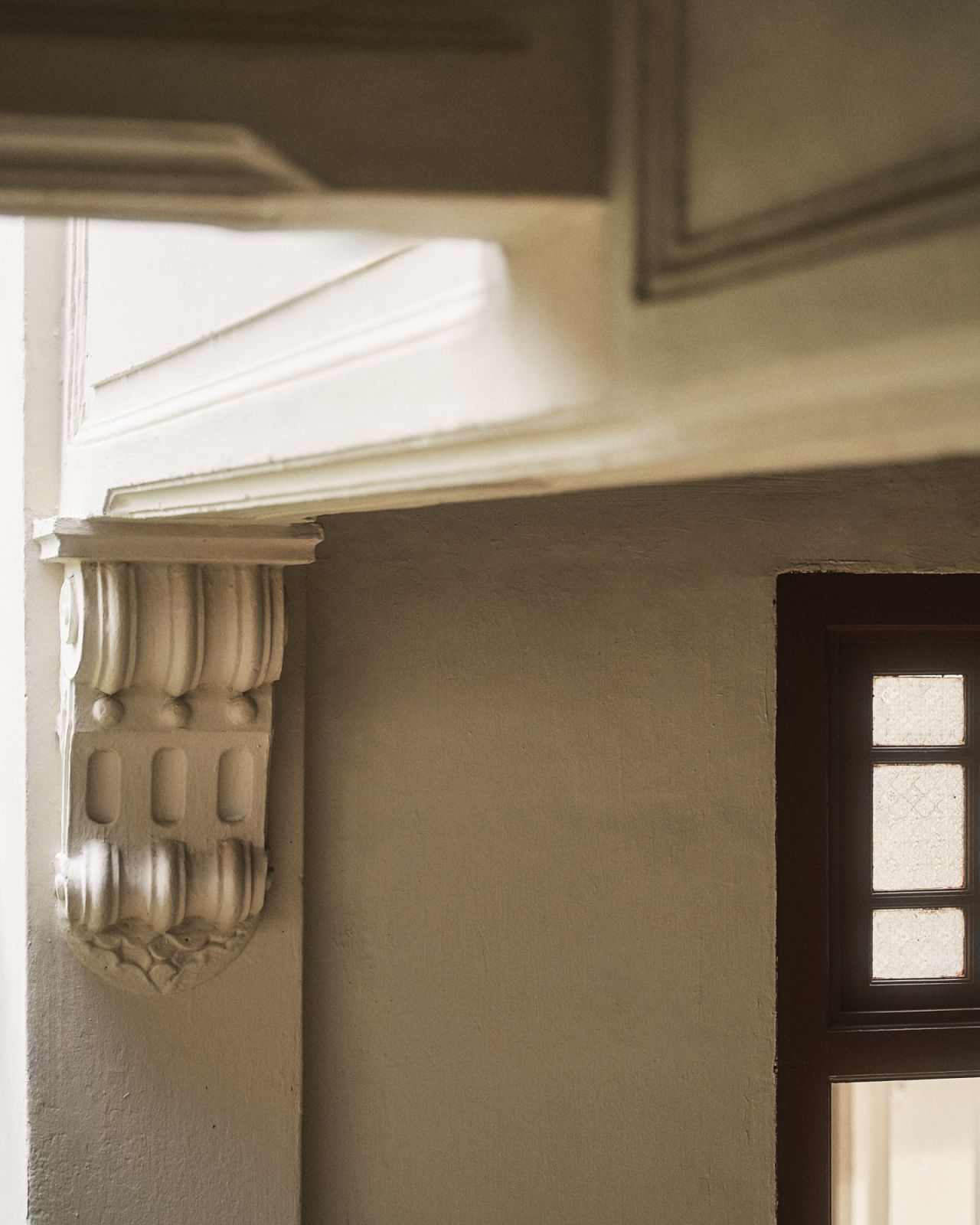 Original architectural details like this decorative corbel showcase the building's 1920s heritage, carefully maintained during the recent refurbishment to preserve the property's historical character