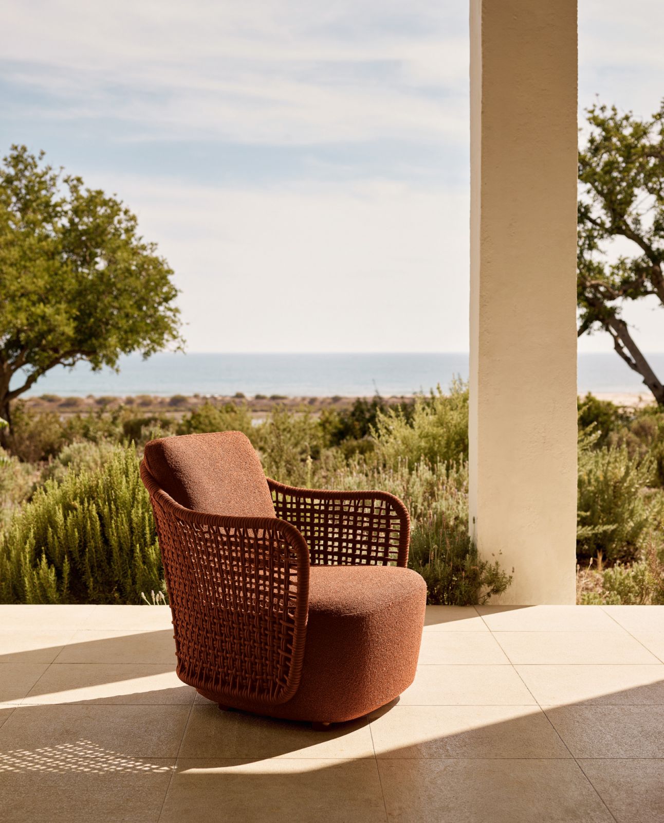 The Mad Out outdoor chair features a wrap-around backrest hand-braided in rope (Photo: Space Furniture)