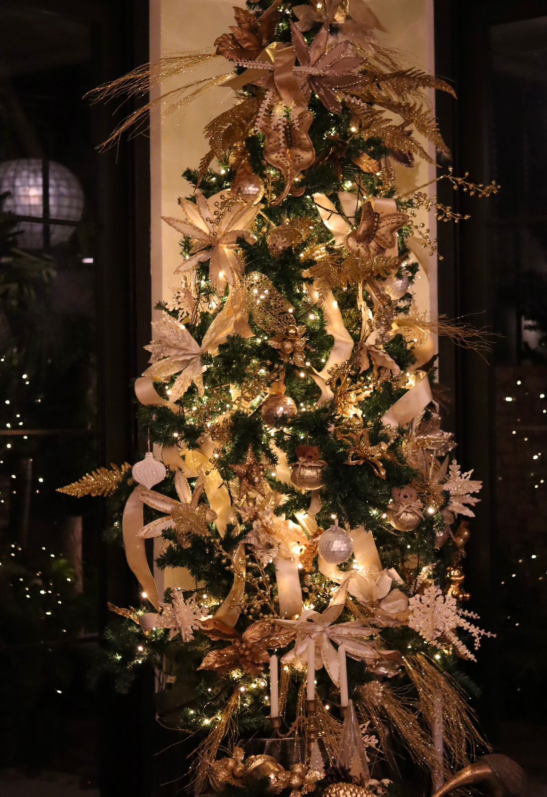 Julie Boschi’s distinctive Christmas tree, with handmade ribbons and clusters of lustrous ornaments