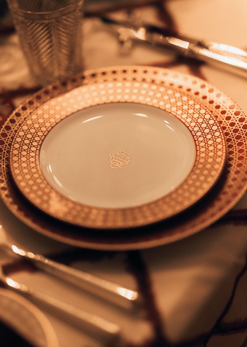 This close-up of Le Noël de Monsieur tableware showcases its woven-cane motif