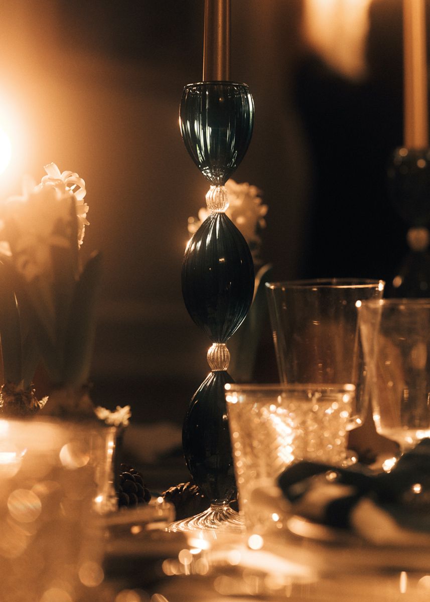 A close-up detail of the elegant green blown-glass Salento candleholder