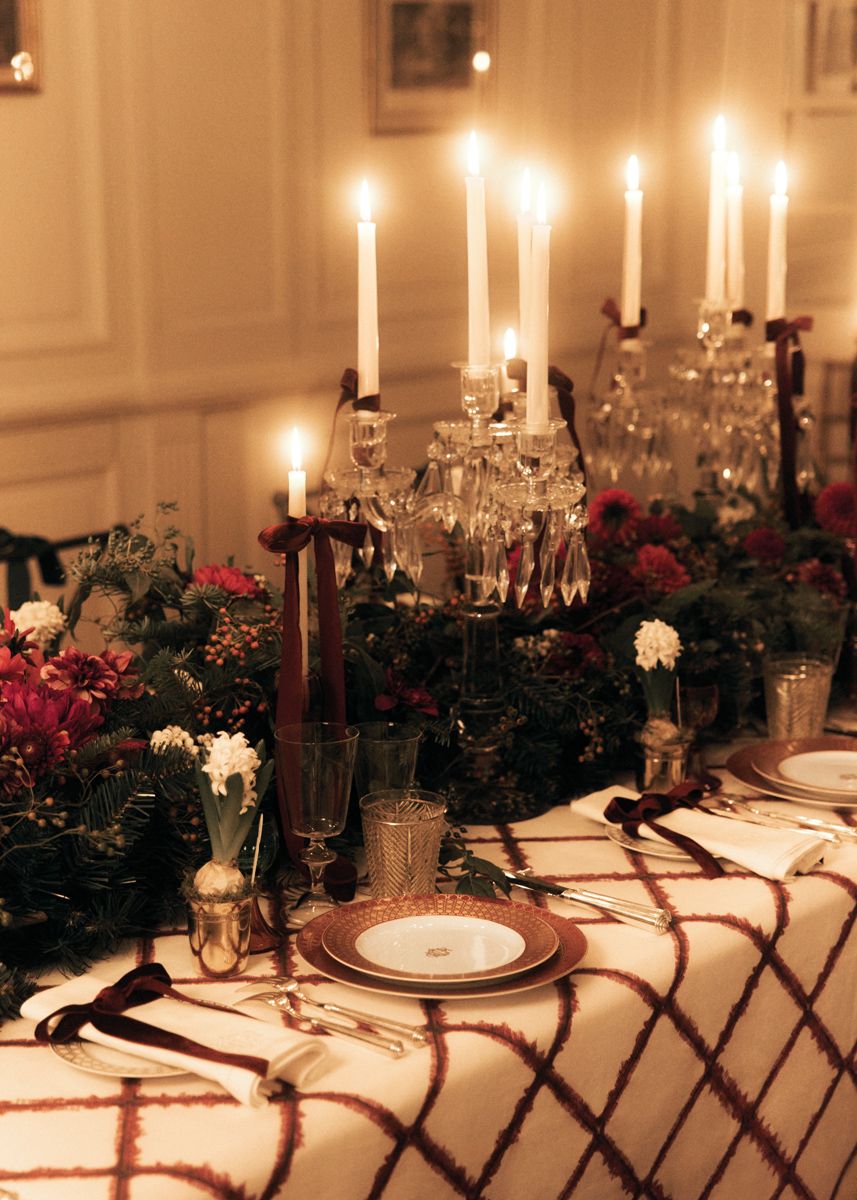 Living flora and patterns across different scales and materials in harmonious colours make for a festive table